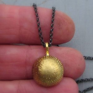 Dome 22k gold pendant on silver chain