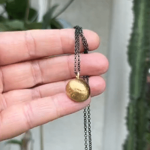 Dome 22k gold pendant on silver chain