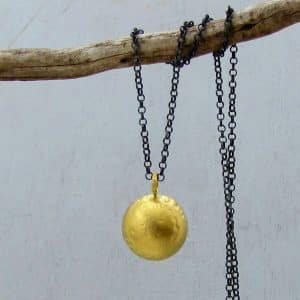 Dome 22k gold pendant on silver chain