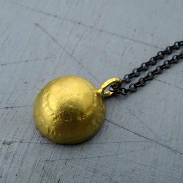 Dome 22k gold pendant on silver chain