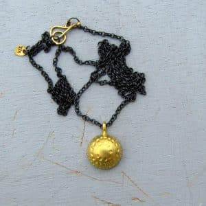 Hammered Dome 22k gold pendant on silver chain