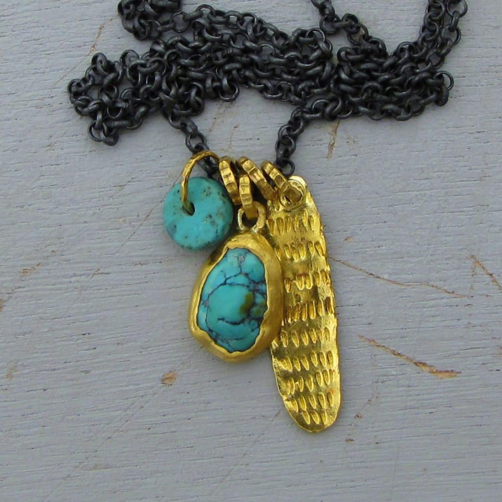 Turquoise 24k gold pendant on a silver chain