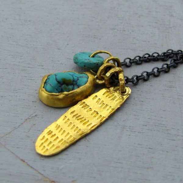 Turquoise 24k gold pendant on a silver chain