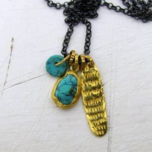 Turquoise 24k gold pendant on a silver chain