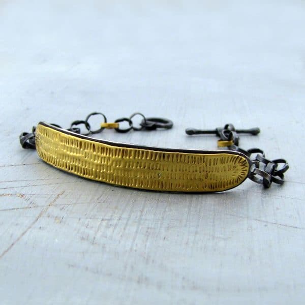 Textured 22k gold bar and silver bracelet